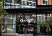 a man standing in front of a google building