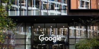 a man standing in front of a google building